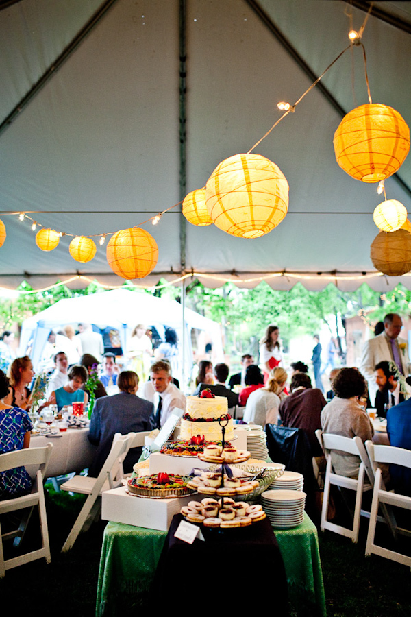outdoor reception seating with dessert buffet and yellow golden chinese paper globe lanterns - photo by New Mexico based wedding photographers Twin Lens